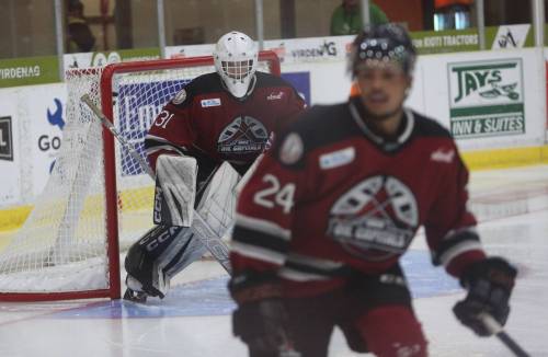 Micky Gross guards the net while Lincoln Black-Greaves guards the middle of the ice at Tundra Oil & Gas Place during the game of the Oil Capitals' pre-season on Wednesday, Sept. 9. Gross will be the started for the 2026-27 season after acting as the backup last season. (Rowan McCarthy/The Brandon Sun).