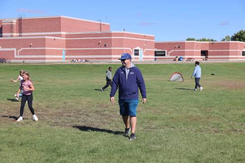 Waverly Park School physical education teacher Shawn Heise walks on the school playground during soccer practice on Tuesday afternoon. (Abiola Odutola/The Brandon Sun)