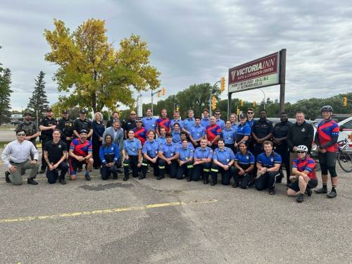York Regional Police Det.-Const. Chris Meuleman (kneels on left) joins other riders, officers of the Brandon Police Service, Manitoba sheriffs, Brandon Fire and Emergency Services members, a Manitoba Conservative Officer, Brandon Mayor Jeff Fawcett and Brandon East MLA Glen Simard as the riders make a stop in Brandon on Sept. 11. (Supplied)