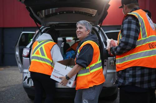 Cyndi Price, a member of the Brandon Bear Clan Women&rsquo;s Council, hands out wraps, vegetables and sandwiches to anyone needing a meal along with other Bear Clan members outside the Brandon Friendship Centre on Princess Avenue on Friday evening at the start of the Bear Clan&rsquo;s patrol of downtown Brandon. (Tim Smith/The Brandon Sun)