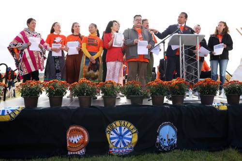 Premier Wab Kinew speaks about the historical record of children who died while at the Brandon Residential School during National Day for Truth and Reconciliation events at the site of the former school on Wednesday. (Tim Smith/The Brandon Sun)