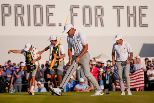 International teams' Corey Conners, of Canada, front, Nick Taylor, of Canada, right, and their caddies celebrate after their Presidents Cup golf tournament third round foursome match against the USA team at Medinah Country Club, Saturday, Sept. 26, 2026, in Medinah, Ill. (AP Photo/Matt Slocum)