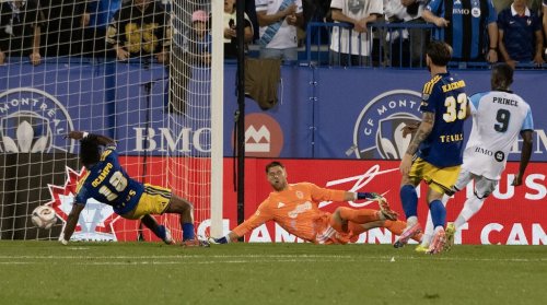 CF Montreal's Prince Owusu (9) scores on Vancouver Whitecaps goalkeeper Isaac Boehmer (second left) during first half MLS soccer action in Montreal on Wednesday, Sept. 16, 2026. THE CANADIAN PRESS/Peter McCabe