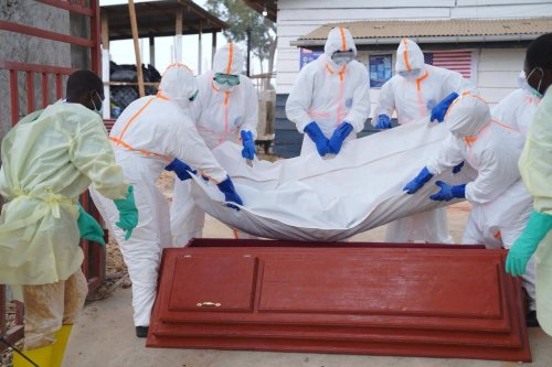 Health workers who are members of the safe and dignified burial team prepare to bury Abineno Justine, a 38 year old woman who died of the Ebola virus, in Bunia, Congo, Friday, Sept. 4, 2026. (AP Photo/Dieudonne Dirole)