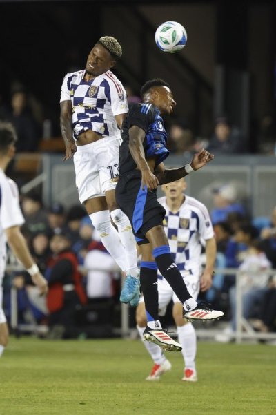 Real Salt Lake midfielder Nelson Palacio (13) and San Jose Earthquakes midfielder Mark-Anthony Kaye (14) compete for the ball during an MLS soccer match, Saturday, Feb. 22, 2025, in San Jose, Calif. (AP Photo/Lachlan Cunningham)