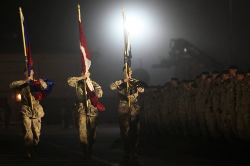 Comrades of fallen Canadian Sgt. Martin Goudreault line up before his casket is carried onto a plane during a ramp ceremony at Kandahar Airfield, Afghanistan on Tuesday, June 8, 2010. (AP Photo/Anja Niedringhaus)