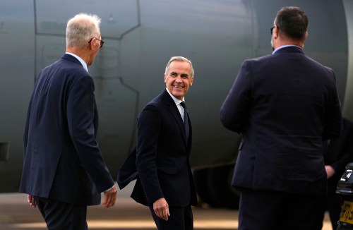 Prime Minister Mark Carney speaks with High Commissioner for Canada in the United Kingdom Bill Blair, left, as he arrives in Manchester, England, on Wednesday, Sept. 16, 2026. THE CANADIAN PRESS/Justin Tang