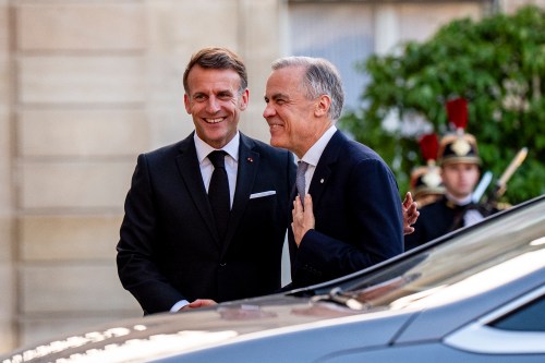 French President Emmanuel Macron, left, greets Canadian Prime Minister Mark Carney, in the courtyard of the Palais de l’Elysee in Paris, on Friday, June 12, 2026. THE CANADIAN PRESS/Christopher Katsarov