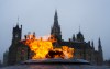 The West Block of Parliament Hill is pictured behind the Centennial Flame as a heavy fog hangs over downtown Ottawa on Thursday, April 16, 2026. THE CANADIAN PRESS/Sean Kilpatrick