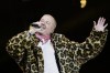 FILE - U.S. rapper Macklemore performs on the Main Stage at the 42th Gurtenfestival edition in Bern, Switzerland, Wednesday, July 16, 2025. (Anthony Anex/Keystone via AP, File)
