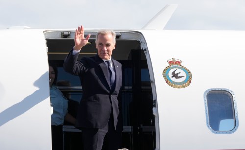 Prime Minister Mark Carney boards a government plane as he departs Saint-Pierre, Saint-Pierre-et-Miquelon, a French territory 20 kilometres off the southern coast of Newfoundland, on Sunday, Sept.20, 2026. THE CANADIAN PRESS/Adrian Wyld