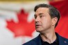 Conservative leader Pierre Poilievre prepares to deliver a message at Cascadia Metals in Delta, B.C., on Friday, August 14, 2026. THE CANADIAN PRESS/Ethan Cairns