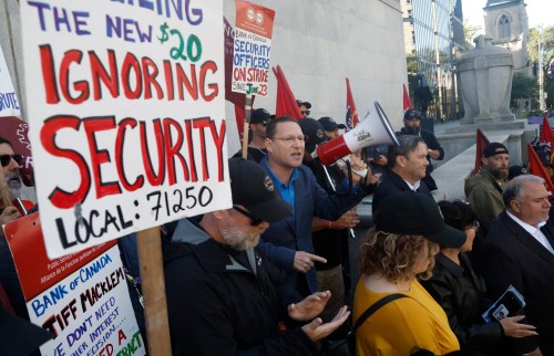 NDP Leader Avi Lewis speaks to striking Bank of Canada security guards on the picket line outside the Bank of Canada in Ottawa on Wednesday, Sept. 23, 2026. THE CANADIAN PRESS/Patrick Doyle
