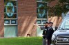 Police stand in front of the Sons of Jacob Synagogue in Belleville, Ontario Ontario on Monday Sept. 21, 2026. A man armed with a shotgun allegedly opened fire at a police officer stationed outside a synagogue in Belleville, Ont., on Sept. 20. THE CANADIAN PRESS/Ian MacAlpine