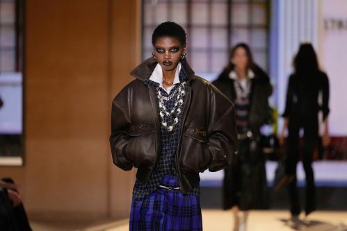 A model wears a creation part of the Gucci women's Spring-Summer 2027 collection, presented in Milan, Italy, Friday, Sept. 25, 2026. (AP Photo/Luca Bruno)