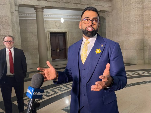 Obby Khan speaks to reporters after being sworn-in as a member of the Manitoba legislature in Winnipeg, Monday, April 4, 2022. Khan won a byelection in the Fort Whyte constituency in Winnipeg on March 22. THE CANADIAN PRESS/Steve Lambert
