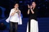 FILE - Chinese singer Na Ying, right, and Taiwanese singer Matilda Tao performs during an public welfare Concert for abused girls at the Taipei Arena in Taipei, Taiwan, April 20, 2014. (AP Photo/Chiang Ying-ying, File)