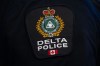 A Delta Police patch is worn by an officer at RCMP 