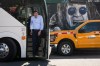 B.C. NDP Leader David Eby steps off his bus for a provincial election campaign stop as artwork of Ozzy Osbourne is seen outside a music shop, in Grand Forks, B.C., on Saturday, Oct. 3, 2026. THE CANADIAN PRESS/Darryl Dyck
