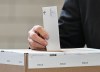 A person votes on election day in Montreal, Monday, Oct. 5, 2026. THE CANADIAN PRESS/Graham Hughes