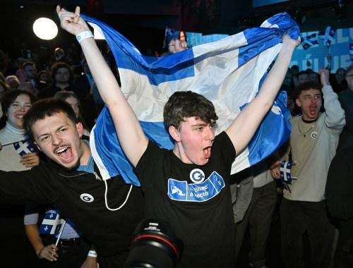 Parti Québécois supporters cheer as results come in at PQ headquarters on election night in Montreal, on Monday, Oct. 5, 2026. THE CANADIAN PRESS/Graham Hughes