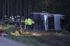 Emergency services at the scene after a tourist bus veered off a highway, in Buchloe, Germany, Sunday, Sept. 27, 2026. (Karl-Josef Hildenbrand/dpa via AP)
