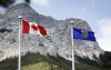 A Canada flag, left, and an Alberta flag flap in the breeze with Mt. Kidd in the background at the site of the G7 Leaders meeting in Kananaskis, Alta., Monday, June 2, 2025.THE CANADIAN PRESS/Jeff McIntosh