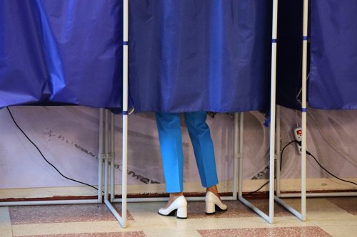 A voter fills-in a ballot during Russia's parliamentary election in Donetsk, in the Russian-controlled part of the Donetsk region, Ukraine, Friday, Sept. 18, 2026. (AP Photo)