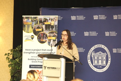 Emilia Cameron, climate resilient communities manager at the Institute for Catastrophic Loss Reduction, delivers a talk during the Brandon Chamber of Commerce luncheon at the Victoria Inn Grand Salon on Thursday. (Abiola Odutola/The Brandon Sun)