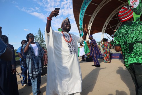 United Nigerians in Brandon Association member Ariyo Peter Omotayo, dressed in a Nigerian traditional gown, dances during the Naija Summer Fest Saturday afternoon at the Riverbank Discovery Centre. (Abiola Odutola/The Brandon Sun)