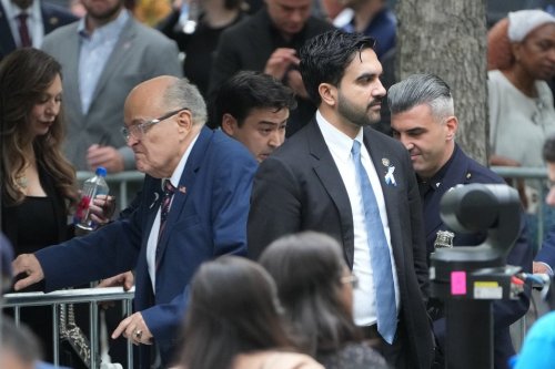 New York Mayor Zohran Mamdani, right, passes former New York Mayor Rudy Giuliani ahead of a ceremony commemorating the 25th anniversary of the Sept. 11, 2001, attacks at the National September 11 Memorial in New York City on Friday, Sept. 11, 2026. (Barry Williams /The Daily News via AP, Pool)