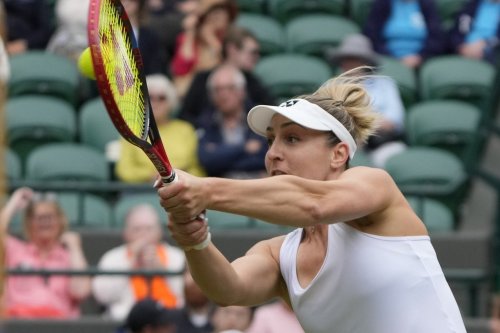 Gabriela Dabrowski of Canada plays return to Caroline Dolehide of the United States and Desirae Krawczyk of the United States during their semifinal doubles match at the Wimbledon tennis championships in London, Friday, July 12, 2024. Dabrowski's playing partner is Erin Routliffe of New Zealand . (AP Photo/Alastair Grant)