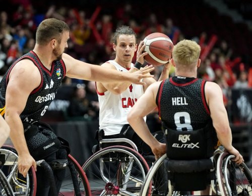 Canada's Nikola Goncin (4) looks to make a pass in front of Germany's Matthias Guntner (6) and Tobias Hell (8) during first half of IWBF Wheelchair Basketball World Championships men's group stage action, in Ottawa, on Friday, Sept. 11, 2026. THE CANADIAN PRESS/Justin Tang