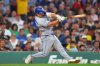Toronto Blue Jays' Davis Schneider hits a one-run double allowing Kazuma Okamoto to score in the sixth inning of a baseball game against the Boston Red Sox, Tuesday, June 16, 2026, in Boston. (AP Photo/Steven Senne)