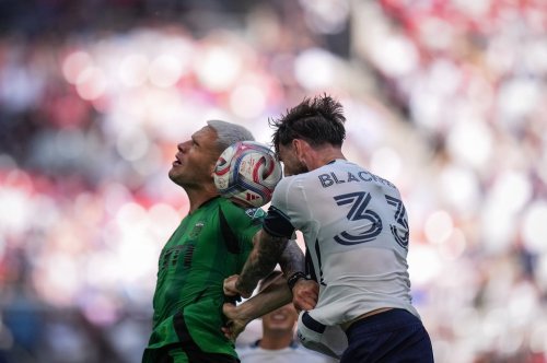 Austin FC's Christian Ramirez, left, and Vancouver Whitecaps' Tristan Blackmon vie for the ball during the first half of an MLS match, in Vancouver, on Sunday, Sept. 13, 2026. THE CANADIAN PRESS/Darryl Dyck