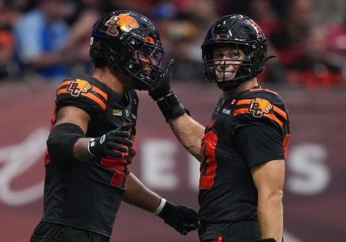 B.C. Lions' Mathieu Betts, right, and Hayden Harris celebrate after Betts sacked Toronto Argonauts quarterback Chad Kelly, not seen, during the first half of a CFL football game, in Vancouver, on Saturday, July 25, 2025. THE CANADIAN PRESS/Darryl Dyck