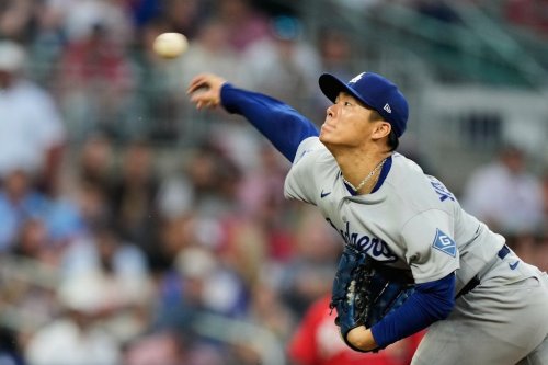 Los Angeles Dodgers' Yoshinobu Yamamoto throws to the Atlanta Braves during the third inning in Game 3 of baseball's National League Division Series, Tuesday, Oct. 6, 2026, in Atlanta. (AP Photo/Brynn Anderson)