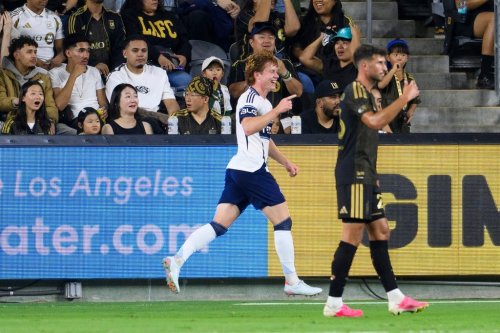 Vancouver Whitecaps FC midfielder Oliver Larraz, left, celebrates his goal during the first half of an MLS soccer match against the Los Angeles Football Club in Los Angeles, Saturday, Oct. 10, 2026. (AP Photo/Kyusung Gong)