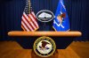 FILE - The U.S. Department of Justice logo is seen on a podium before a press conference, May 6, 2025, at the Justice Department in Washington. (AP Photo/Julia Demaree Nikhinson, File)