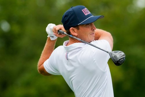 USA teams' Jacob Bridgeman hits from the second tee against the International team during the Presidents Cup golf tournament second round foursomes match at Medinah Country Club, Friday, Sept. 25, 2026, in Medinah, Ill. (AP Photo/Chris Carlson)