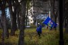 Posts questioning the results in Alberta's referendum spread on the social media platform X this week as the numbers were released. An attendee stands in the trees during an Alberta independence rally at the Alberta legislature, in Edmonton on Saturday, Oct. 17, 2026. THE CANADIAN PRESS/Amanda May Erickson