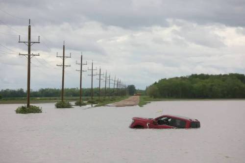 Swathes of farm land were submerged and municipal roads and provincial highways were washed out by overland flooding from western Manitoba to the Interlake after severe flooding hit several communities in June and July. (Tim Smith/The Brandon Sun files)
