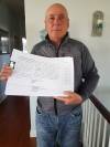 Dennis Rome is seen in 2020 with an unrelated petition. Rome, a former councillor in Oakland-Wawanesa who opposed the bylaw earlier this year, said he is not surprised that the Manitoba Municipal Board sided with the municipality. (The Brandon Sun files)