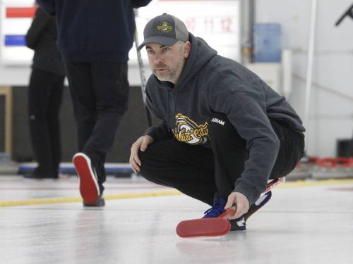 Cale Dunbar looks on as his teammates sweep after delivering a rock during the men&rsquo;s A-side championship. The president of the Westman Superleague is excited for the league to expand to 14 teams this year. (Brandon Sun files)