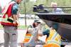Parks Canada staff are shown inspecting and tagging boats in Wasagaming in 2023. The motorized boating season at Clear Lake is slated to come to an end after Thanksgiving Monday. (Tim Smith/The Brandon Sun files)