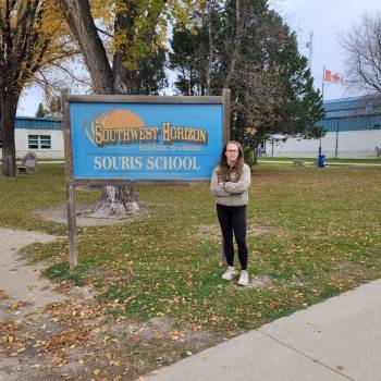Souris School parent Hannah Prince stands in front of the school on the weekend. (Supplied)