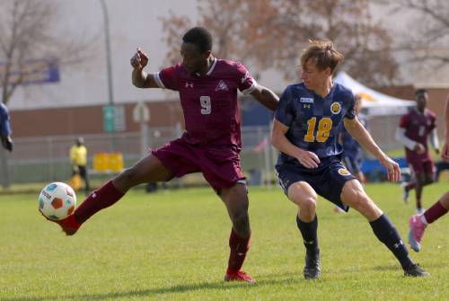 Assiniboine College's Adeniyi Adetunmobi and Brandon University's Levi Francis battle for the ball during their MCAC men's soccer game at the Healthy Living Centre field on Saturday. Brandon won 9-0. (Thomas Friesen/The Brandon Sun)