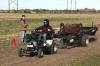 A University of Saskatchewan student pulls a heavy sled using one of the 1/4-scale tractors designed by the Sled Dogs engineering team at the farm of Kenny Beauchemin near Warman, Sask. on Oct. 3. (Kevin Berger/Clark&rsquo;s Crossing Gazette)