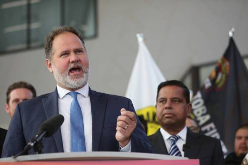 Federal Public Safety Minister Gary Anandasangaree watches Manitoba Justice Minister Matt Wiebe as he speaks during a press conference at the Waywayseecappo Convention Centre north of Brandon on Friday morning. (Photos by Matt Goerzen/The Brandon Sun)