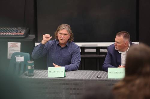 Mayor Jeff Fawcett (left) responds to a question while fellow candidate Len Isleifson looks on during the mayoral candidate forum organized by École secondaire Neelin High School students on Friday morning. (Photos by Abiola Odutola/The Brandon Sun)